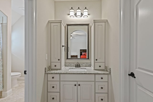 bathroom with vanity and toilet