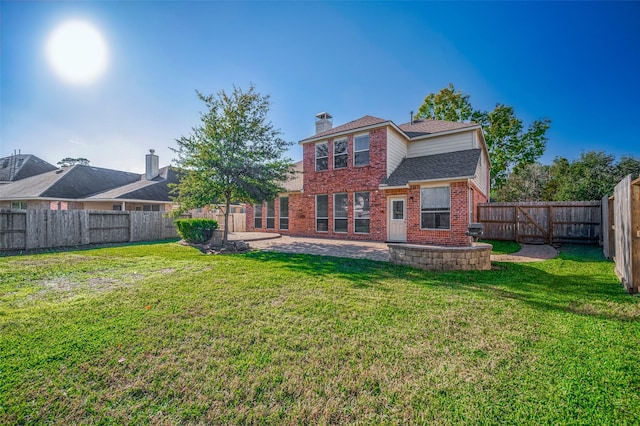 back of property featuring a yard, brick siding, roof with shingles, and a fenced backyard