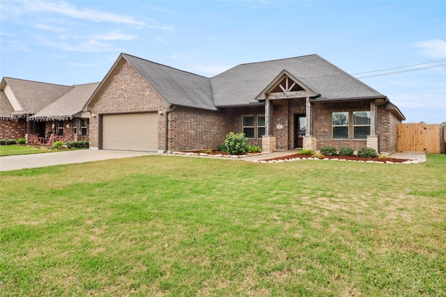 view of front of home featuring a garage and a front yard