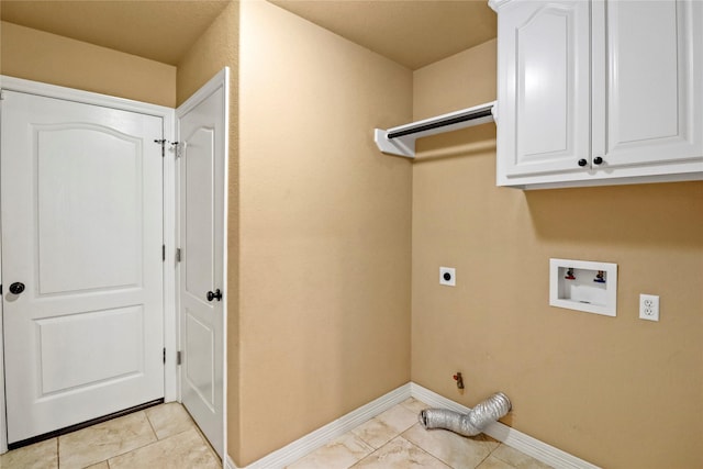 washroom featuring hookup for an electric dryer, light tile patterned floors, hookup for a washing machine, and cabinets