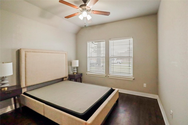 bedroom featuring ceiling fan, dark hardwood / wood-style floors, and lofted ceiling