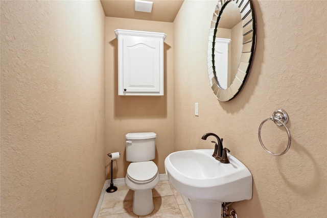 bathroom with sink and toilet