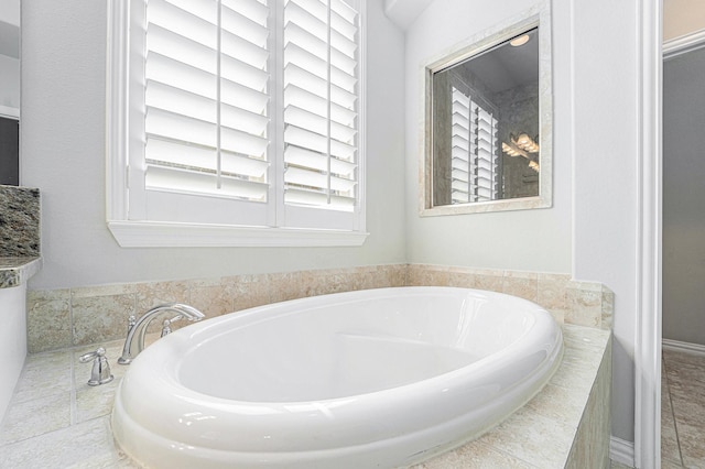 bathroom with tiled bath