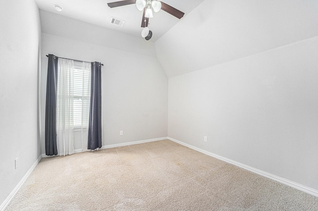 additional living space featuring carpet flooring, vaulted ceiling, and ceiling fan