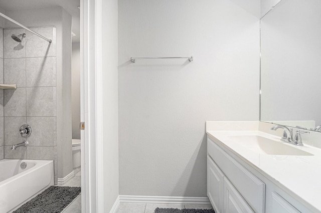 full bathroom with tile patterned flooring, vanity, toilet, and tiled shower / bath