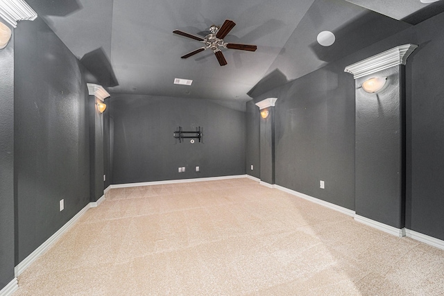 home theater room with carpet floors, decorative columns, ceiling fan, and lofted ceiling