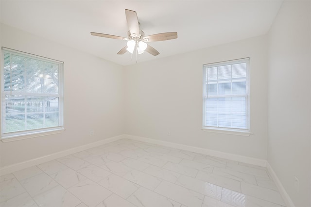 unfurnished room with ceiling fan