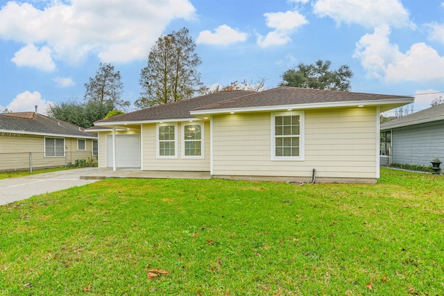 ranch-style home featuring a garage and a front lawn