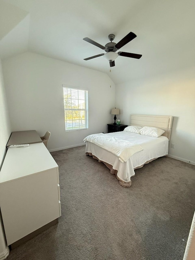 carpeted bedroom featuring ceiling fan and lofted ceiling