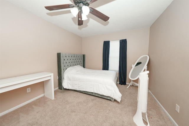 bedroom featuring ceiling fan and light carpet