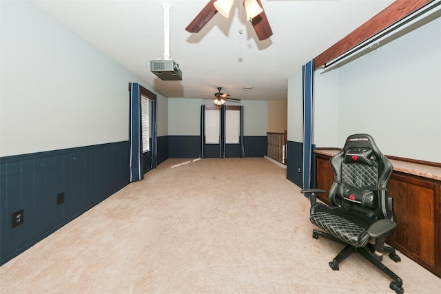 cinema featuring ceiling fan and carpet floors