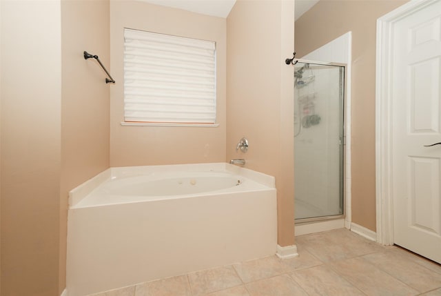 bathroom with tile patterned floors and independent shower and bath