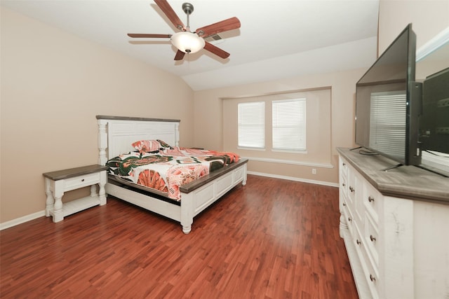 bedroom with ceiling fan, dark hardwood / wood-style floors, and vaulted ceiling