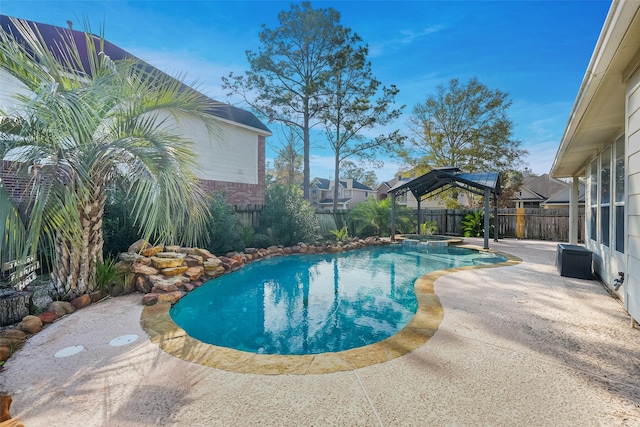 view of pool featuring an in ground hot tub and a patio