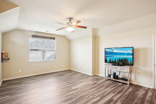 unfurnished living room featuring ceiling fan, wood-type flooring, and vaulted ceiling