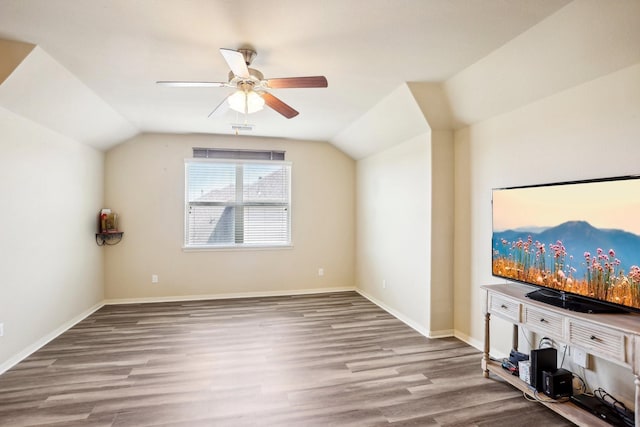 additional living space with ceiling fan, lofted ceiling, and light wood-type flooring