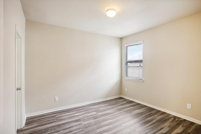 unfurnished room featuring hardwood / wood-style flooring