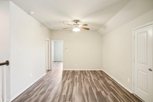 unfurnished room featuring ceiling fan, wood-type flooring, and vaulted ceiling