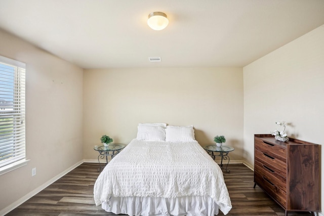 bedroom featuring dark hardwood / wood-style flooring