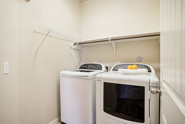 laundry room with separate washer and dryer