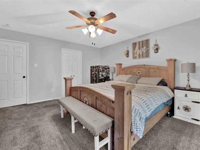 bedroom with dark colored carpet and ceiling fan