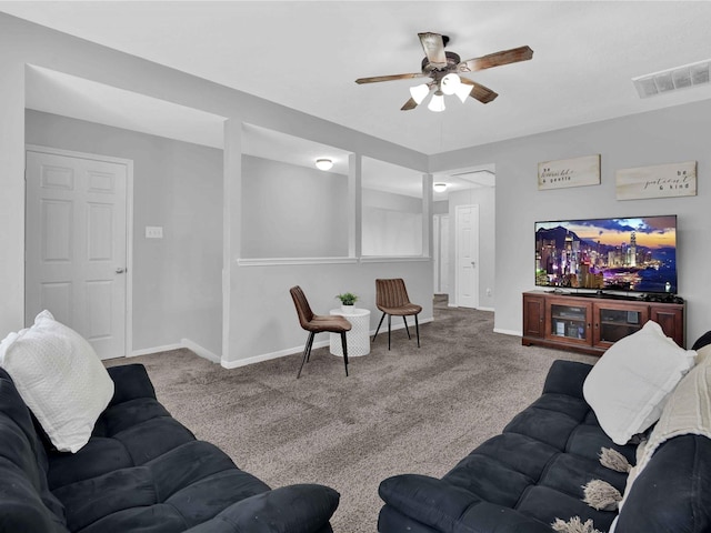 carpeted living room with ceiling fan