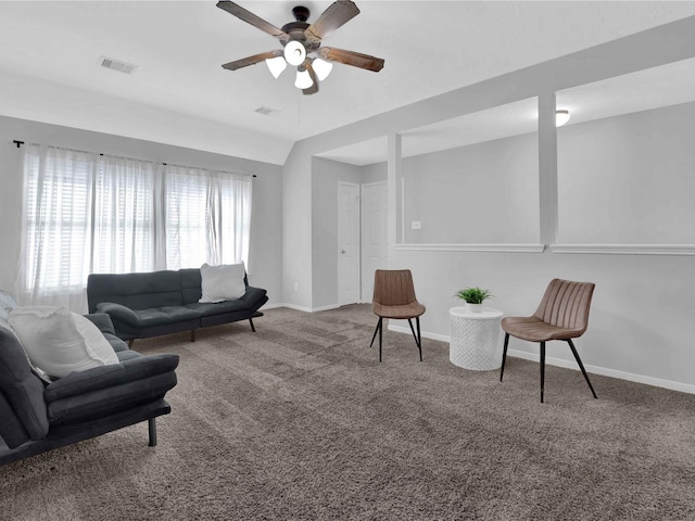 carpeted living room with ceiling fan