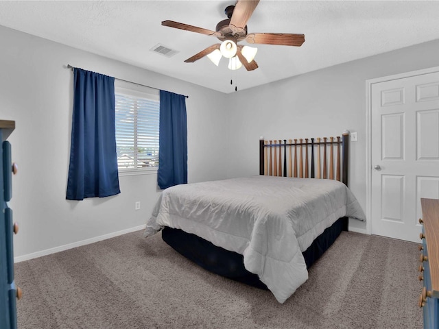 bedroom with ceiling fan and carpet