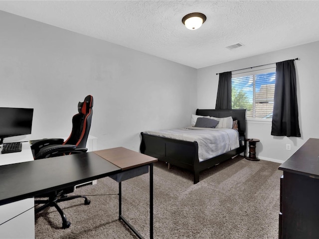 carpeted bedroom with a textured ceiling