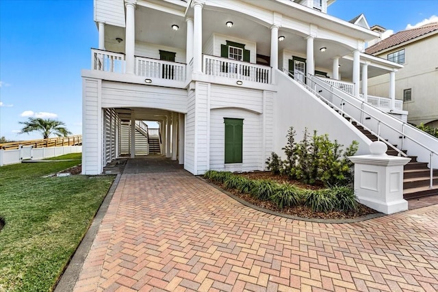 view of front facade with a carport and a porch