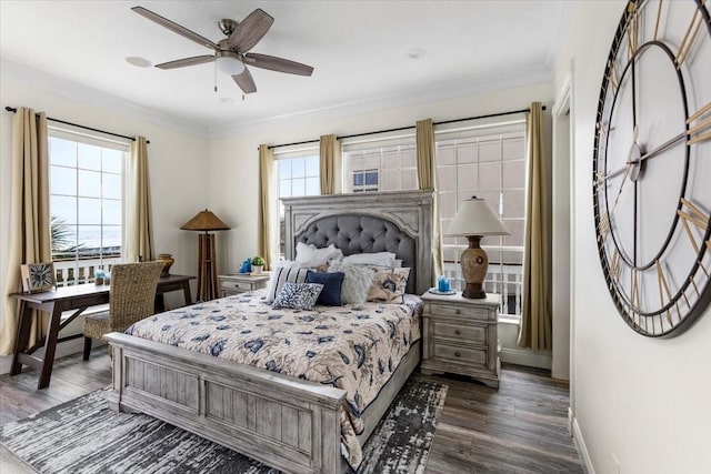 bedroom with multiple windows, ceiling fan, dark wood-type flooring, and ornamental molding