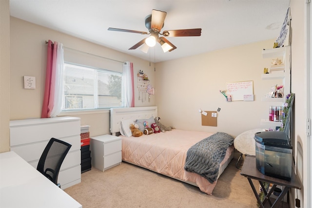 bedroom with light carpet and ceiling fan