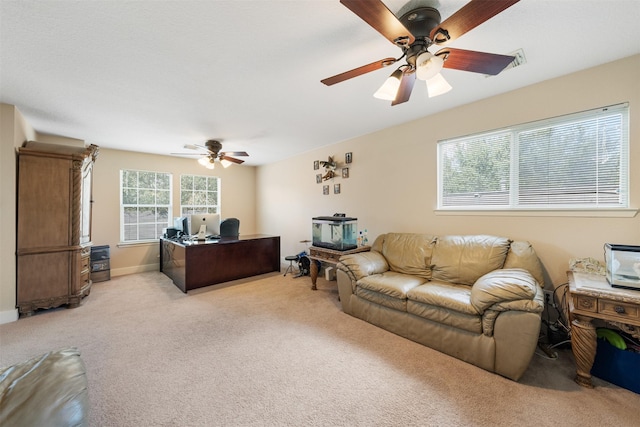 carpeted office with ceiling fan