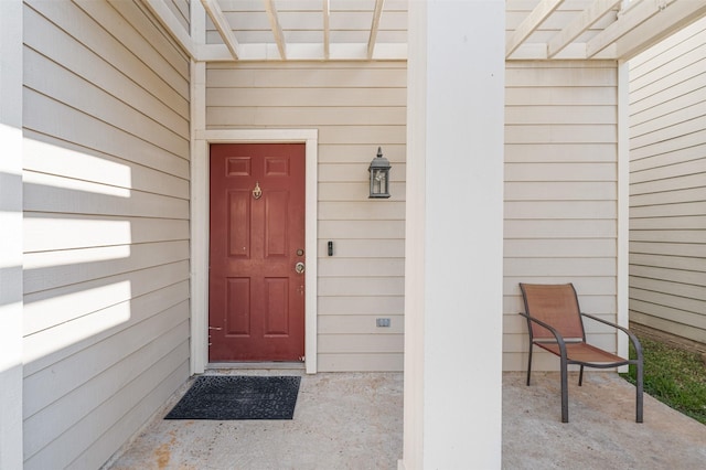 entrance to property featuring a patio