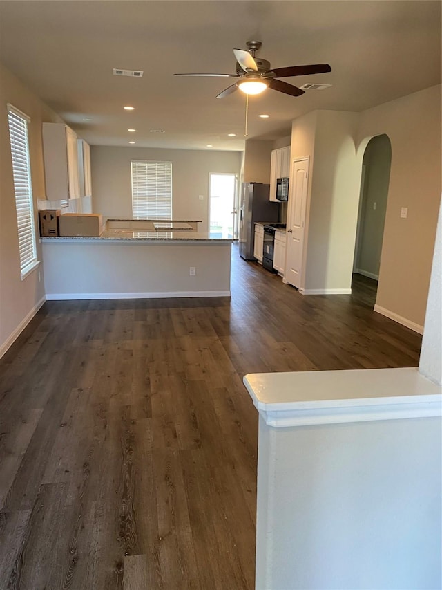 kitchen featuring white cabinetry, ceiling fan, dark hardwood / wood-style flooring, kitchen peninsula, and black appliances