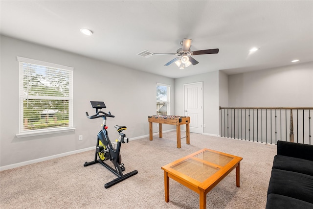 workout area featuring carpet flooring and ceiling fan