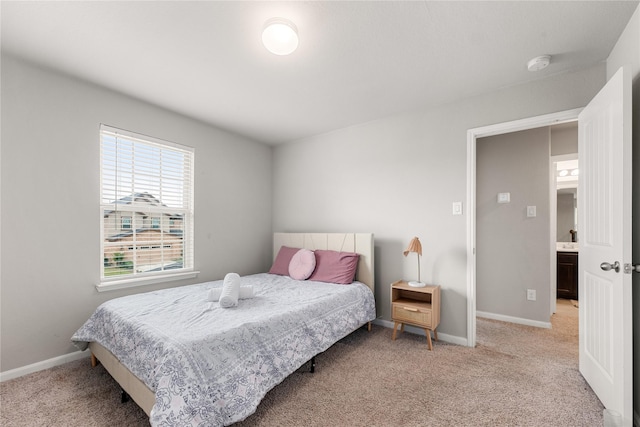 bedroom with light colored carpet