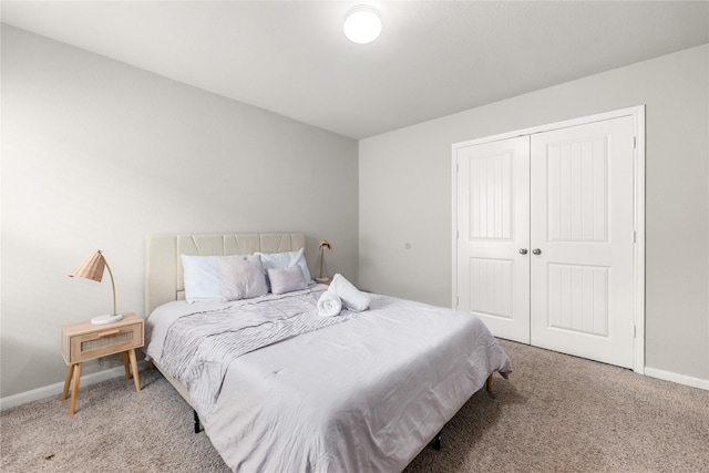 bedroom featuring carpet and a closet