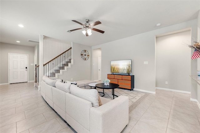 living room with ceiling fan and light tile patterned floors