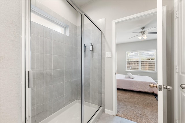 bathroom with tile patterned floors, walk in shower, and ceiling fan