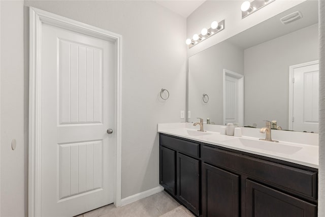 bathroom featuring tile patterned floors and vanity