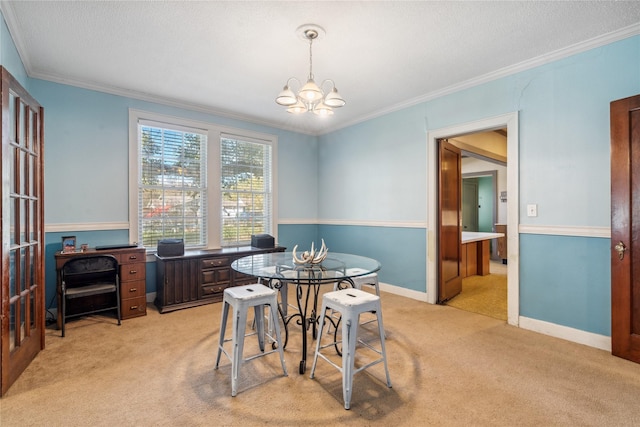 dining space featuring ornamental molding, light carpet, and an inviting chandelier