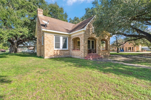 view of front of home featuring covered porch and a front yard