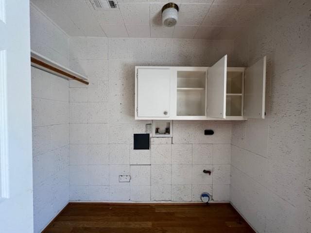 washroom with hookup for a washing machine and dark hardwood / wood-style floors