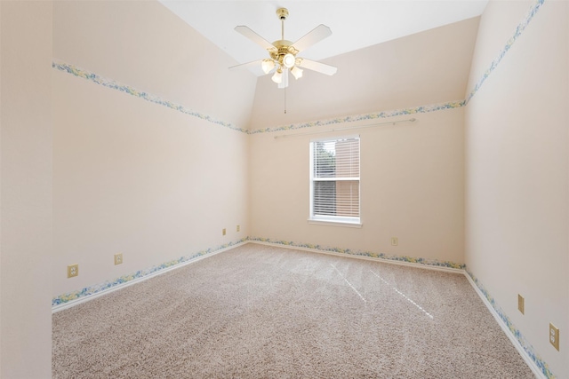 unfurnished room with ceiling fan, carpet, and vaulted ceiling