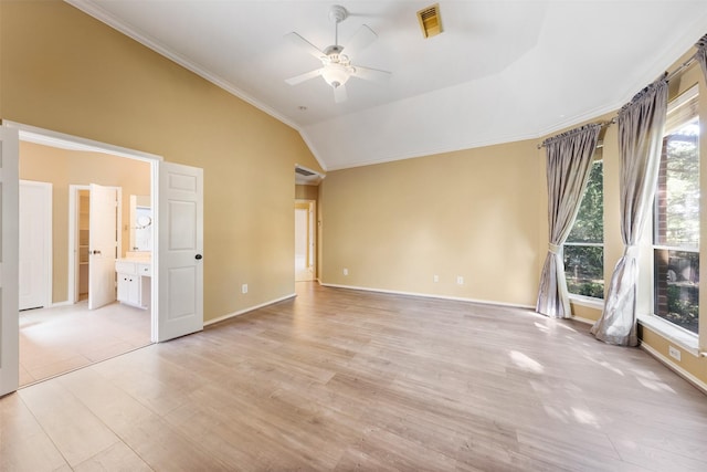 unfurnished bedroom featuring multiple windows, ceiling fan, light hardwood / wood-style floors, and lofted ceiling