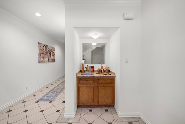 bathroom with vanity and ornamental molding