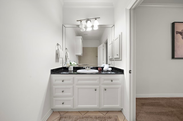 bathroom with tile patterned floors, crown molding, and vanity