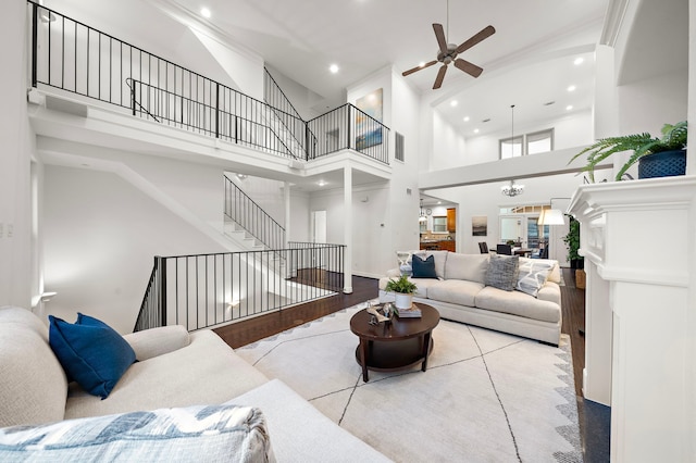 tiled living room with a towering ceiling and ceiling fan