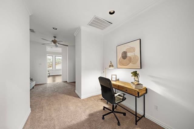 carpeted office space with ceiling fan and ornamental molding